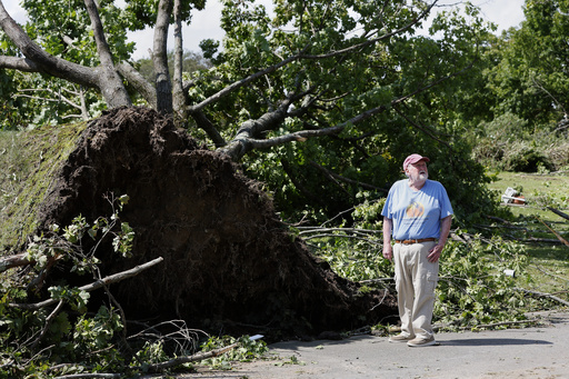 Highland Memorial Park Cemetery president Joe Swift inspects damage to the grounds, Friday, Aug. 18, 2023, in Johnston, R.I.