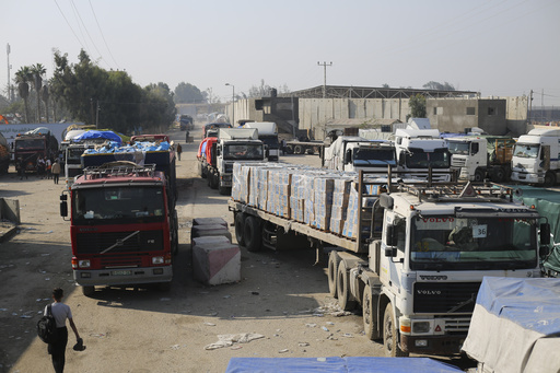 Humanitarian aid trucks enter through the Kerem Shalom crossing from Israel into the Gaza Strip on Dec. 18, 2023.  (AP)